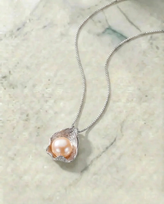 Echte roze parelketting met schelp