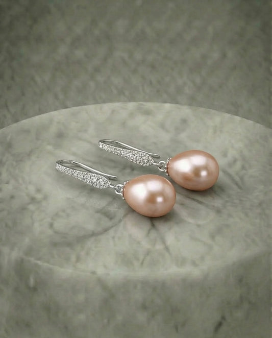 Elegante perzikparel oorbellen 